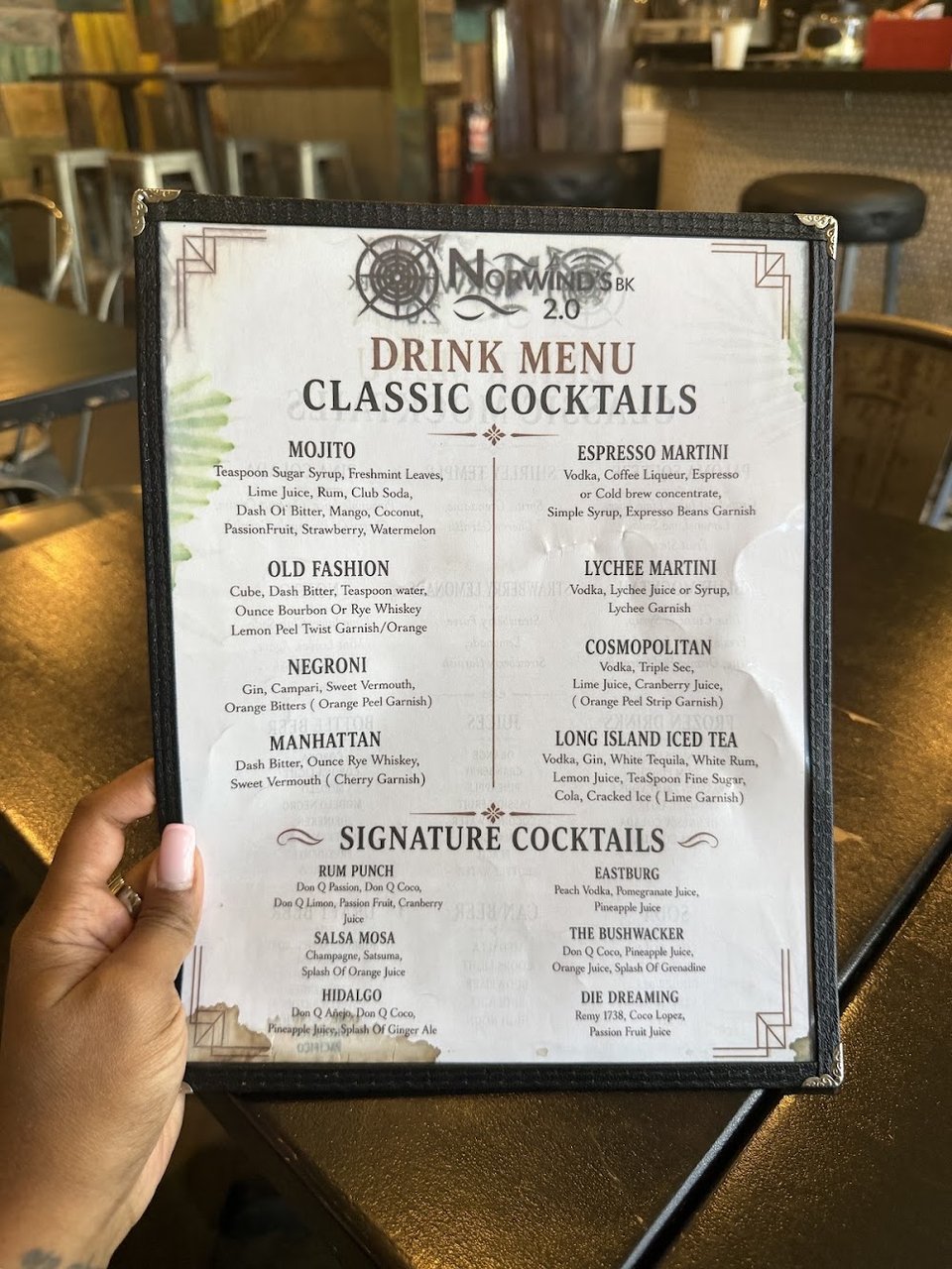 Printed menu with Puerto Rican dishes and cocktails.