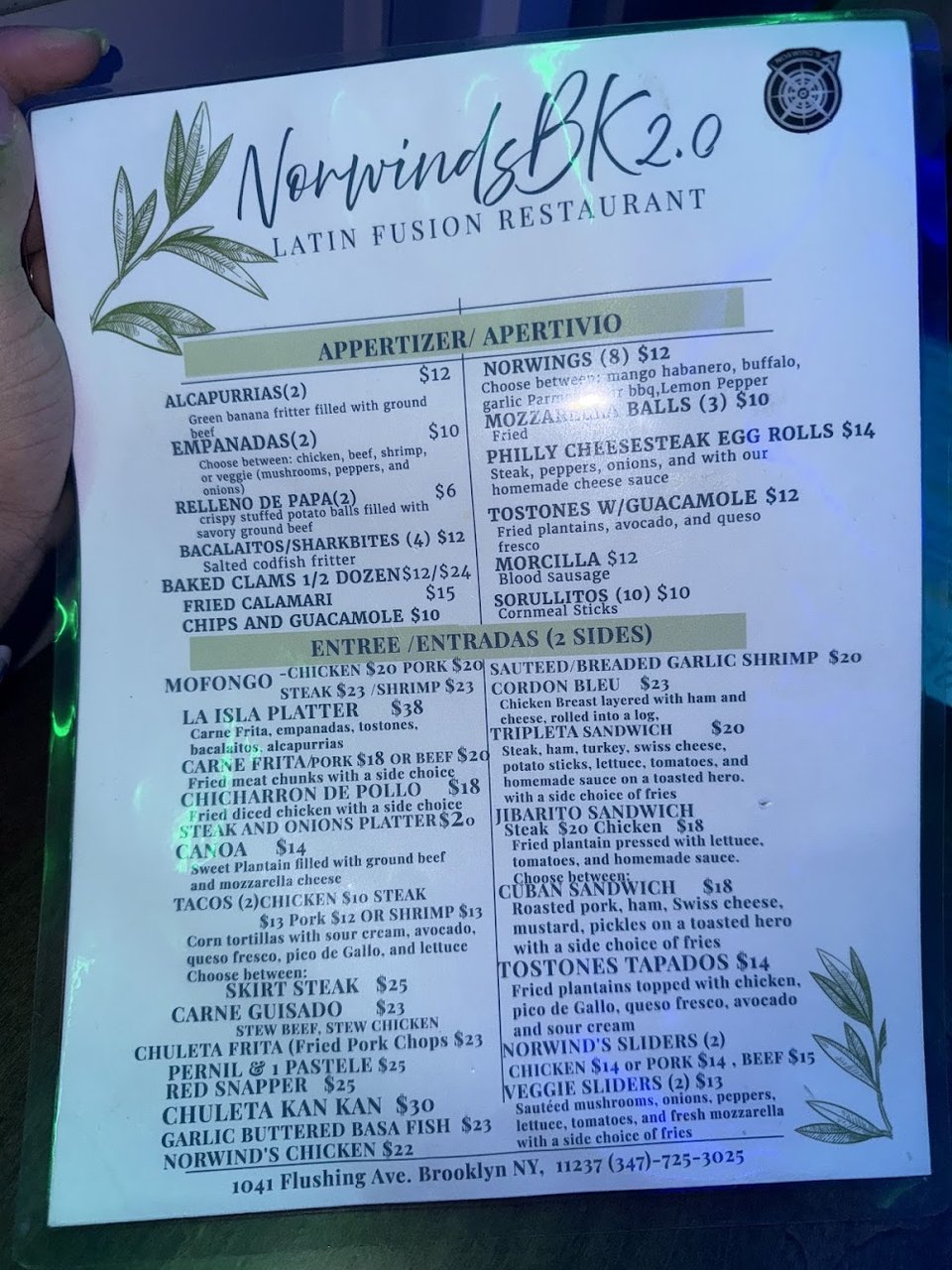 Restaurant menu listing comfort foods and bottle service.